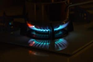 Blue flames of gas burning from a kitchen gas stove